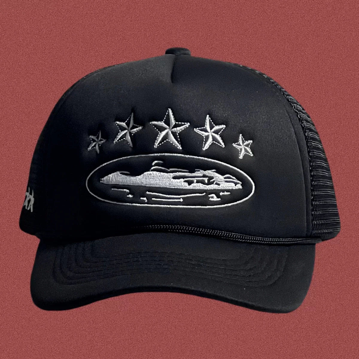 Corteiz Black Trucker Hat with Silver Stars and Cruise Ship Graphic